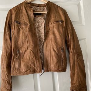 Real Brown leather jacket cinched at the waist